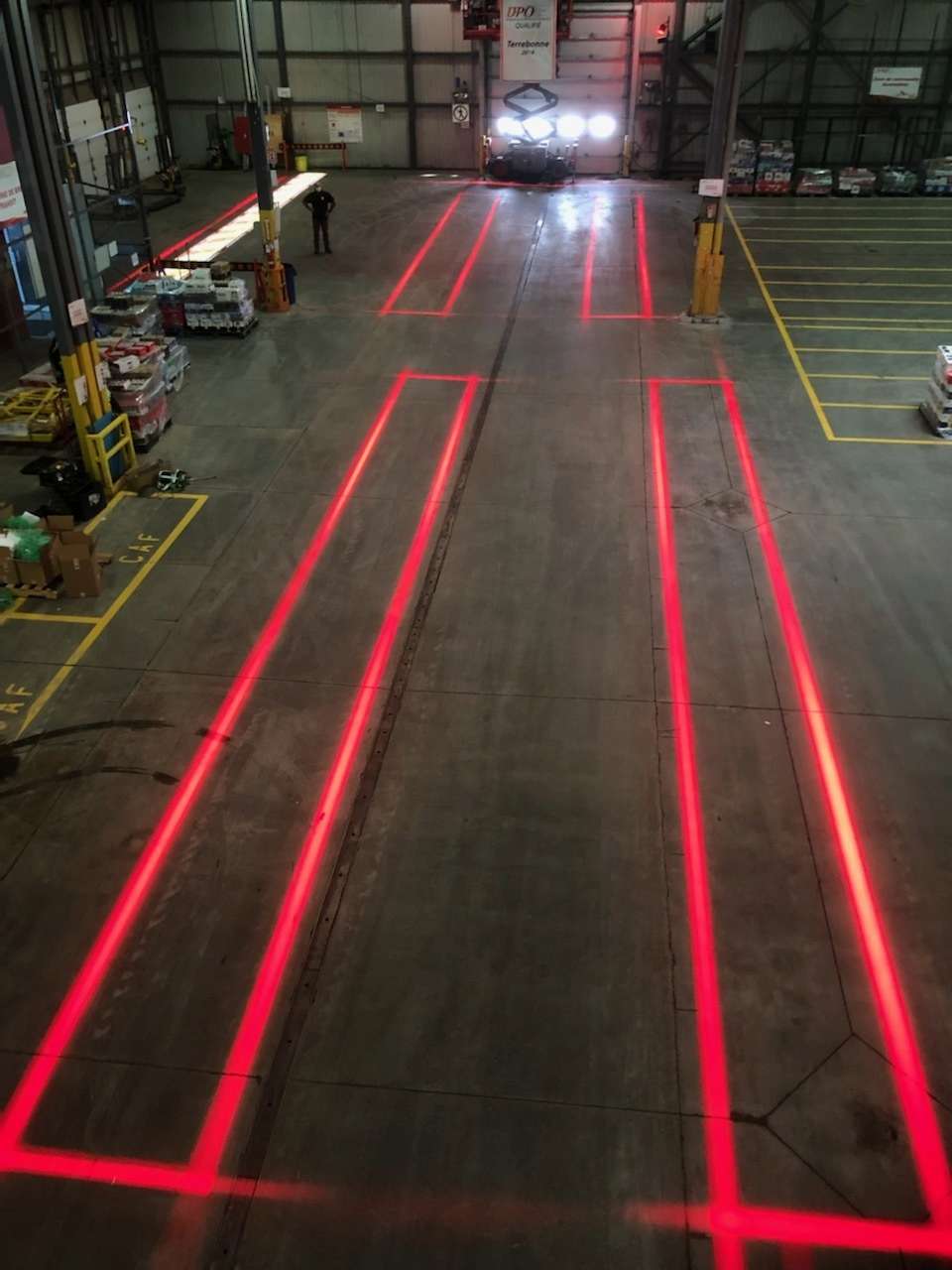 Bright red light projected onto the floor for the exclusion zone demarcation